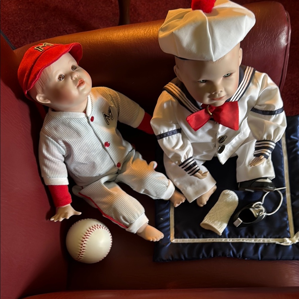Pair of Ashton Drake collectible porcelain dolls.
